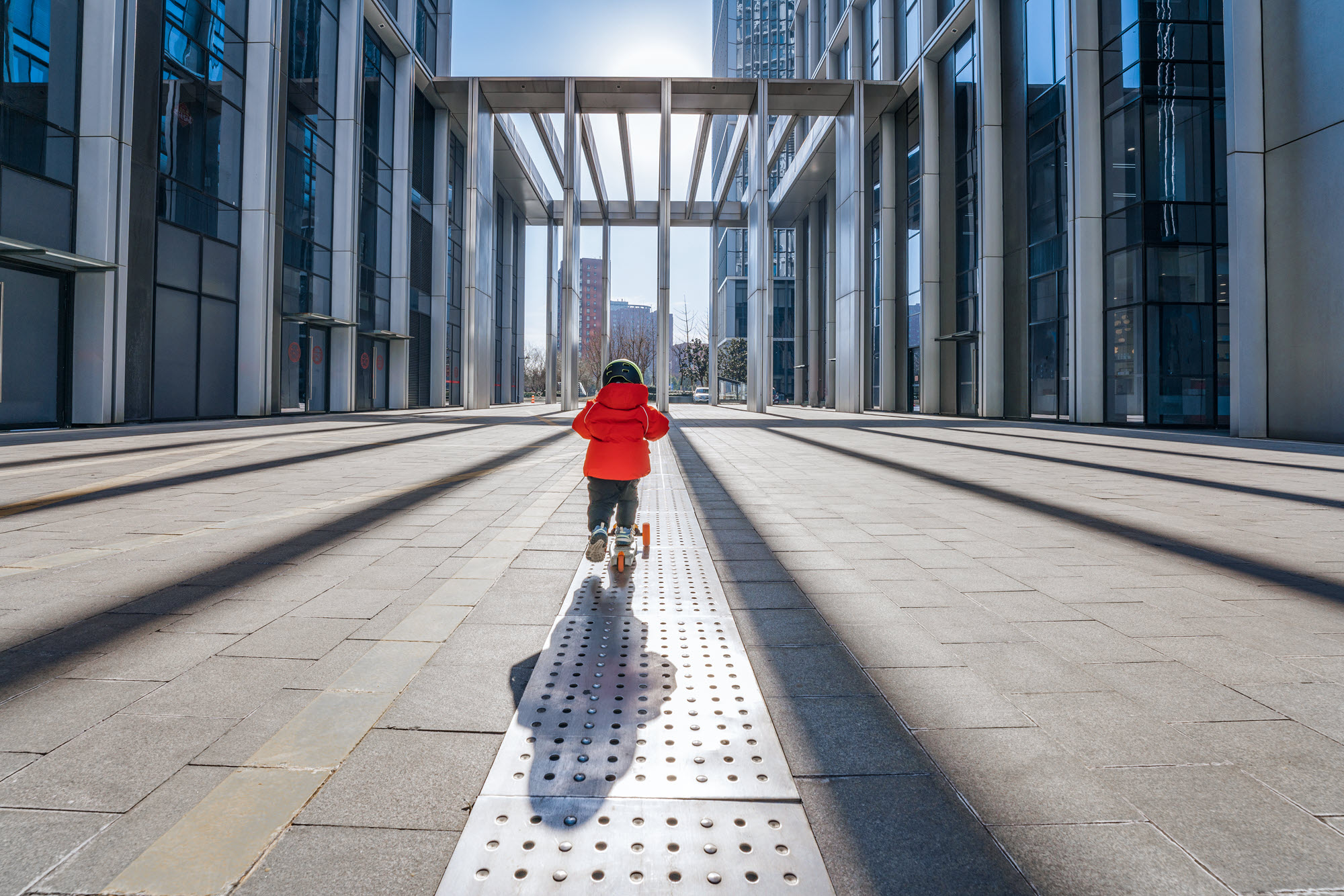 photo of child walking across bridge